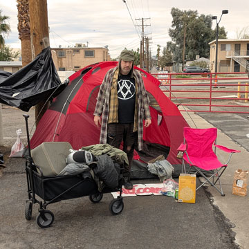 Nick Wells as Norm outside his makeshift home