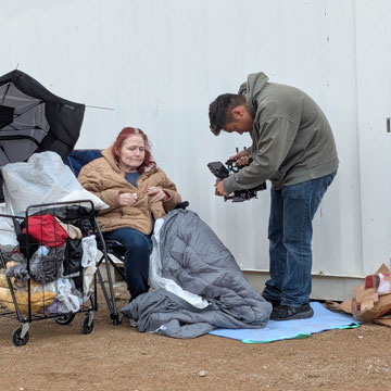 Theresa Goldston being captured on video by DoP Anthony Le at her makeshift home