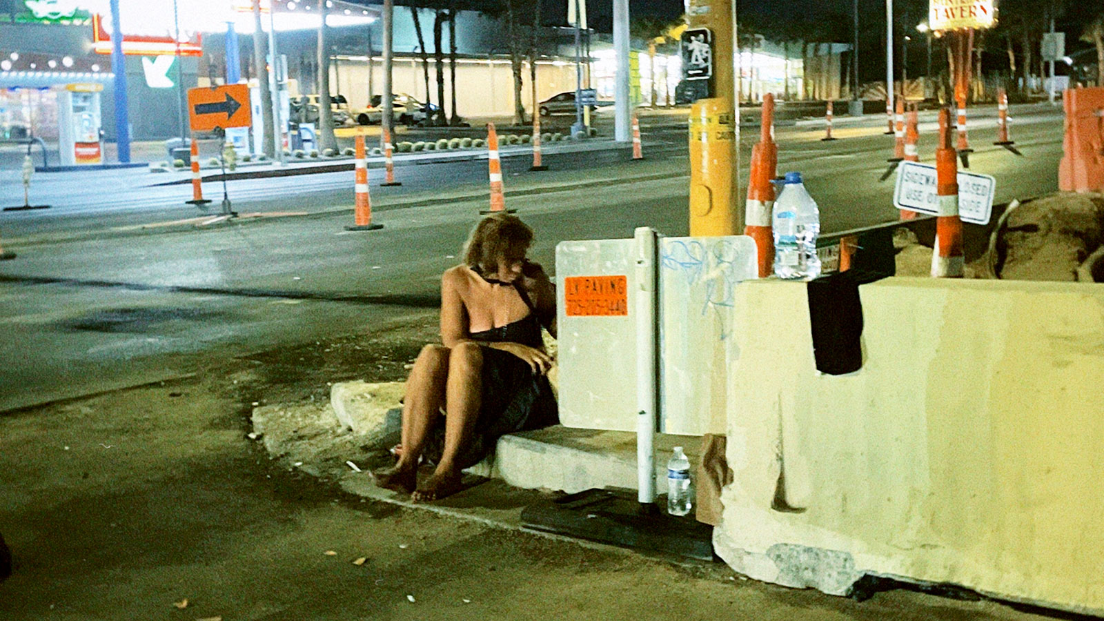 Unhoused woman on a deconstructed street corner